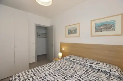 Letto o letti in una camera di Adamaina - Sea view apartment with private garage