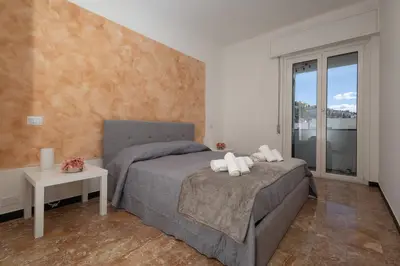 Letto o letti in una camera di Casa Daniela - terrazza vista mare super centrale