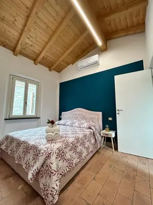 Letto o letti in una camera di B&B Il Podestà