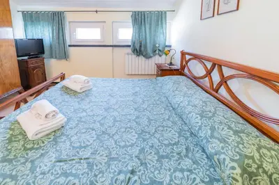 Letto o letti in una camera di 124 - Casa con Terrazza Sestri- 15Minuti a piedi dal Centro