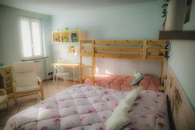 Letto o letti in una camera di B&B LA MIMOSA E IL GELSOMINO