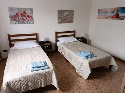Letto o letti in una camera di Casa Fiume