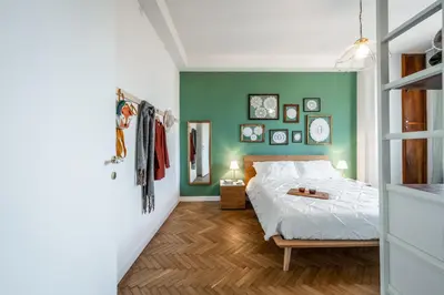 Letto o letti in una camera di DALLA BRUNA - Above the roofs of the centre