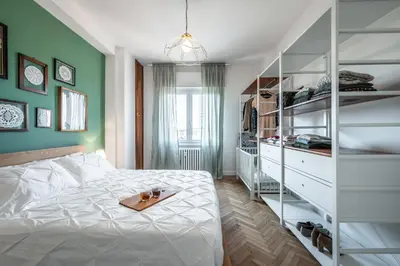Letto o letti in una camera di DALLA BRUNA - Above the roofs of the centre