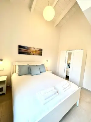Letto o letti in una camera di Isola