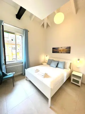 Letto o letti in una camera di Isola