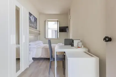 Letto o letti in una camera di Center Rooms
