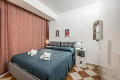 Letto o letti in una camera di Casa Camilla - Arty Suite nel centro storico