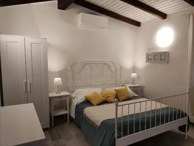 Letto o letti in una camera di Affittacamere Ca der Culunellu