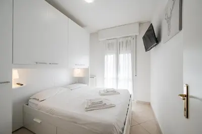 Letto o letti in una camera di Formigine - [Motor Valley-Homes]
