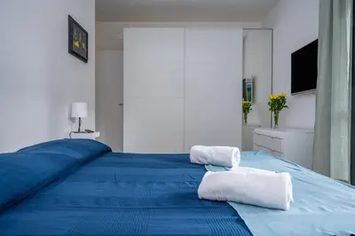 Letto o letti in una camera di GuestHost - Parma Residential Flat with balconyParma Residential Apartment con balcone