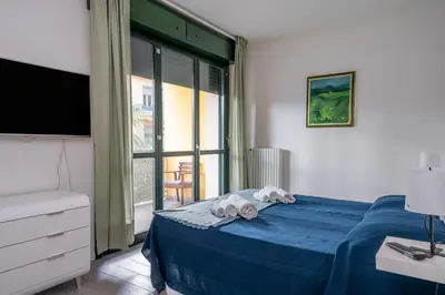 Letto o letti in una camera di GuestHost - Parma Residential Flat with balconyParma Residential Apartment con balcone