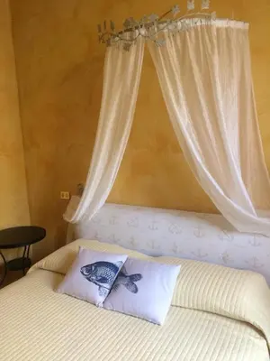 Letto o letti in una camera di Lola a Moneglia