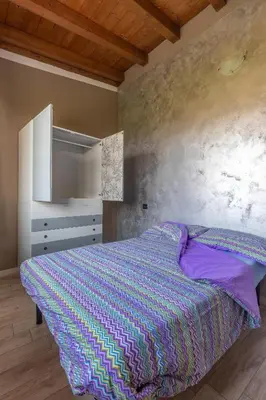 Letto o letti in una camera di Angolo Nascosto Apartments