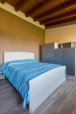 Letto o letti in una camera di Angolo Nascosto Apartments