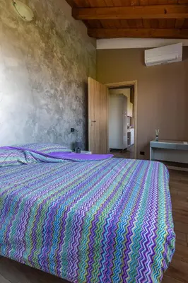 Letto o letti in una camera di Angolo Nascosto Apartments