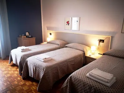 Letto o letti in una camera di ALBERGO BALDAZZI 1916