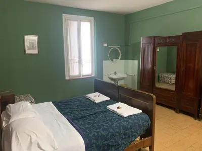 Letto o letti in una camera di Leon doro